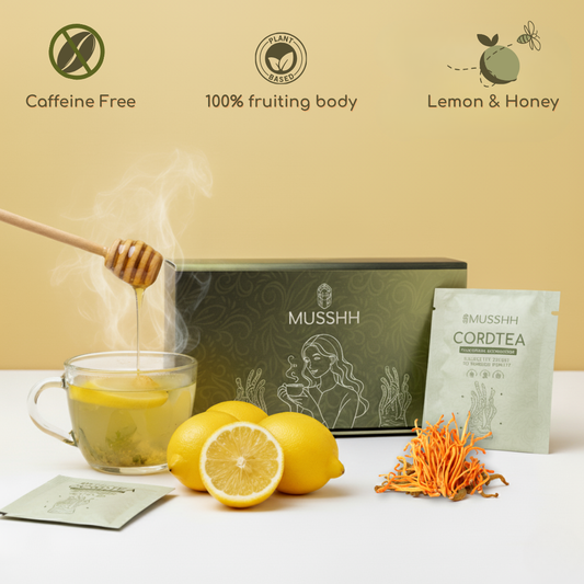 Mushroom tea setup with lemons, honey, and Musshh packaging on a light background